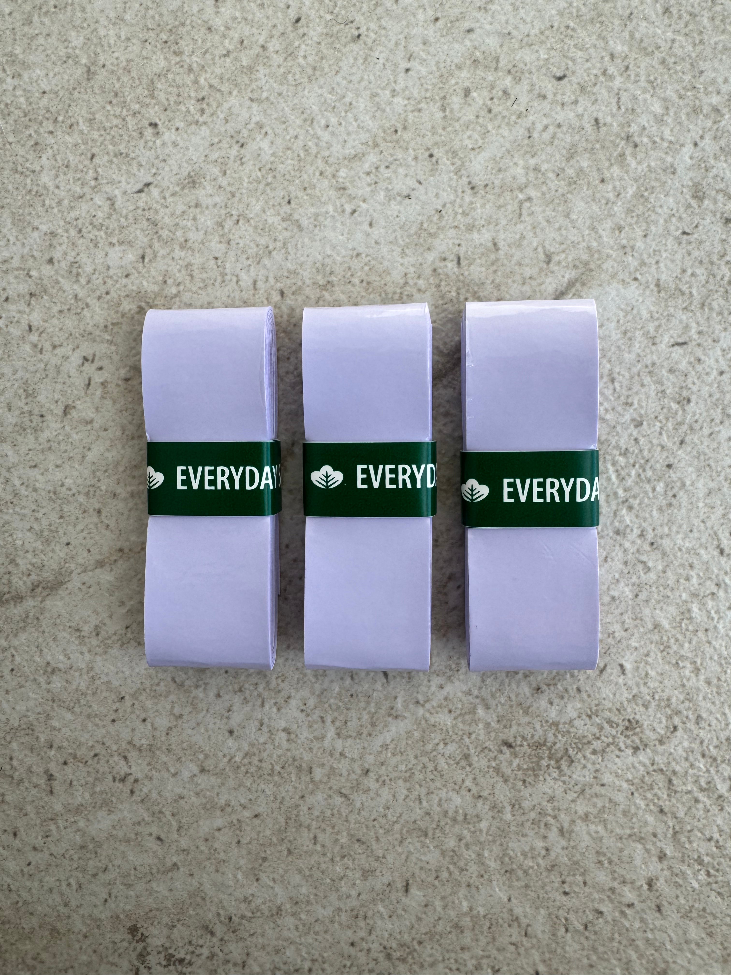 EVERYDAY SOCIAL® Packaged tennis, padel, pickleball overgrips with 'Everyday Social' branding on a marble surface
