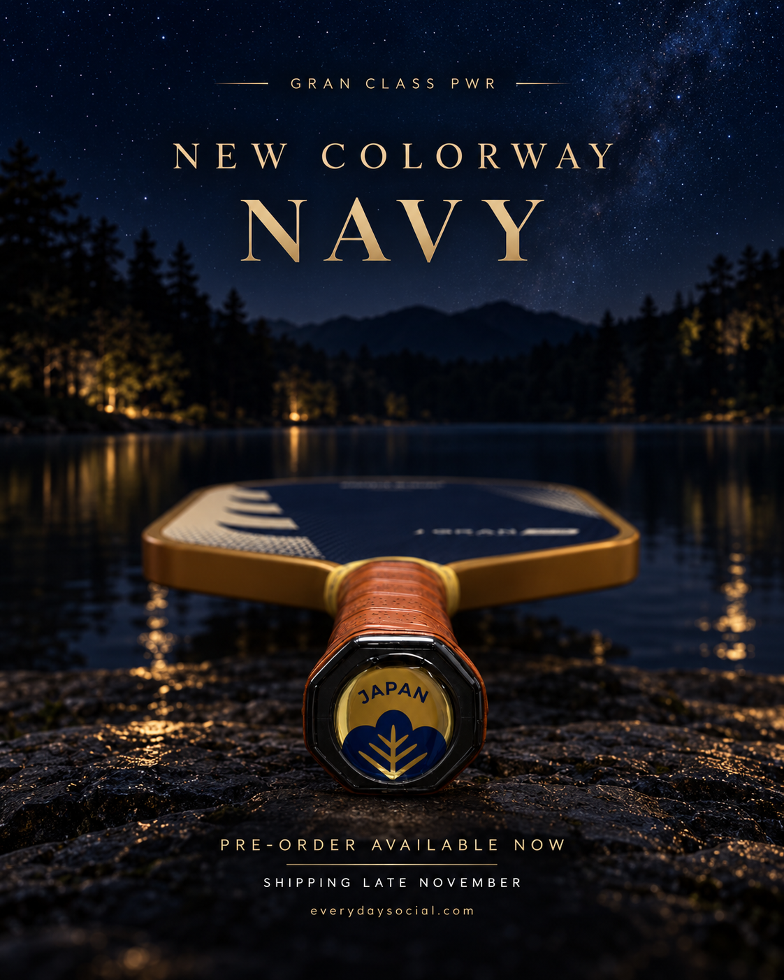 GRAN CLASS PWR Navy & Gold paddle under a starry night sky with amber lights reflecting on the water