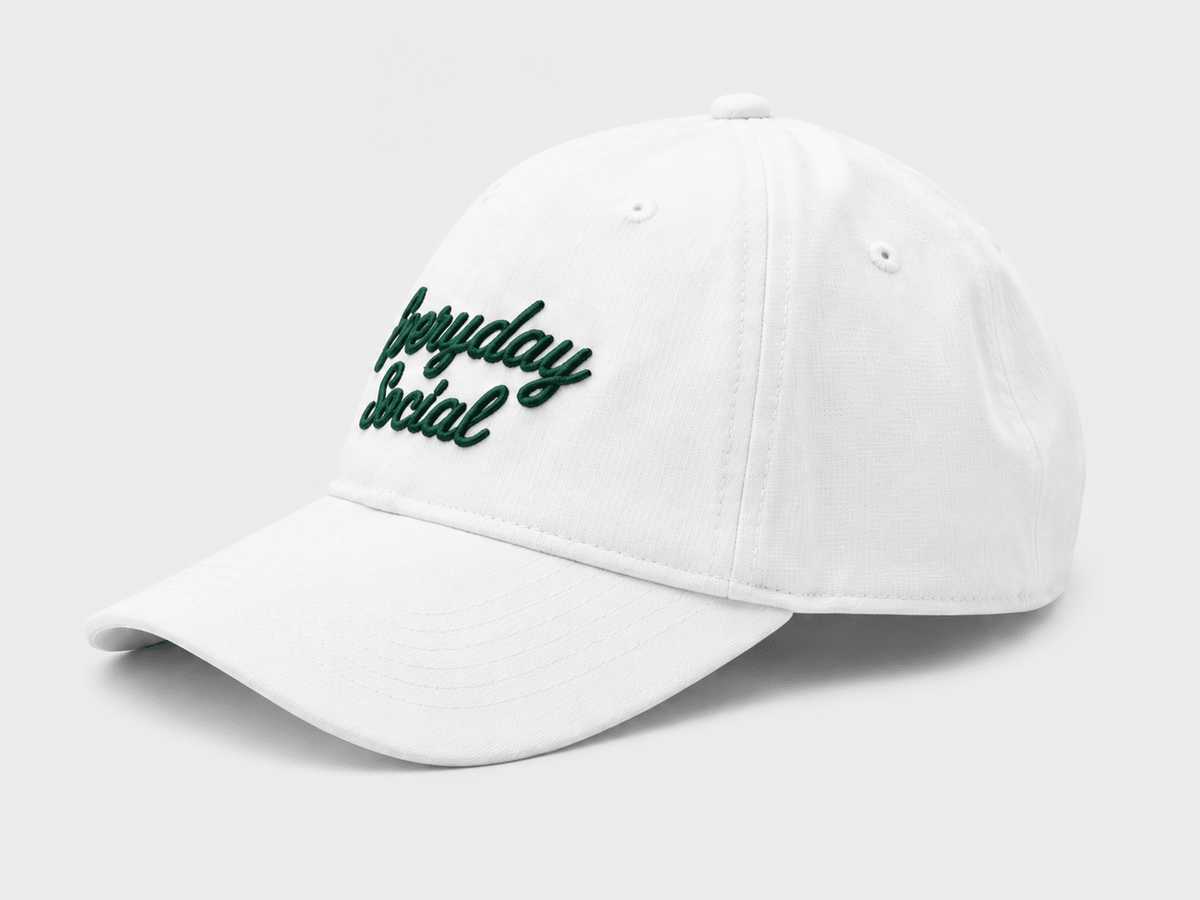 White EVERYDAY SOCIAL Signature Hat with green embroidered logo, side view